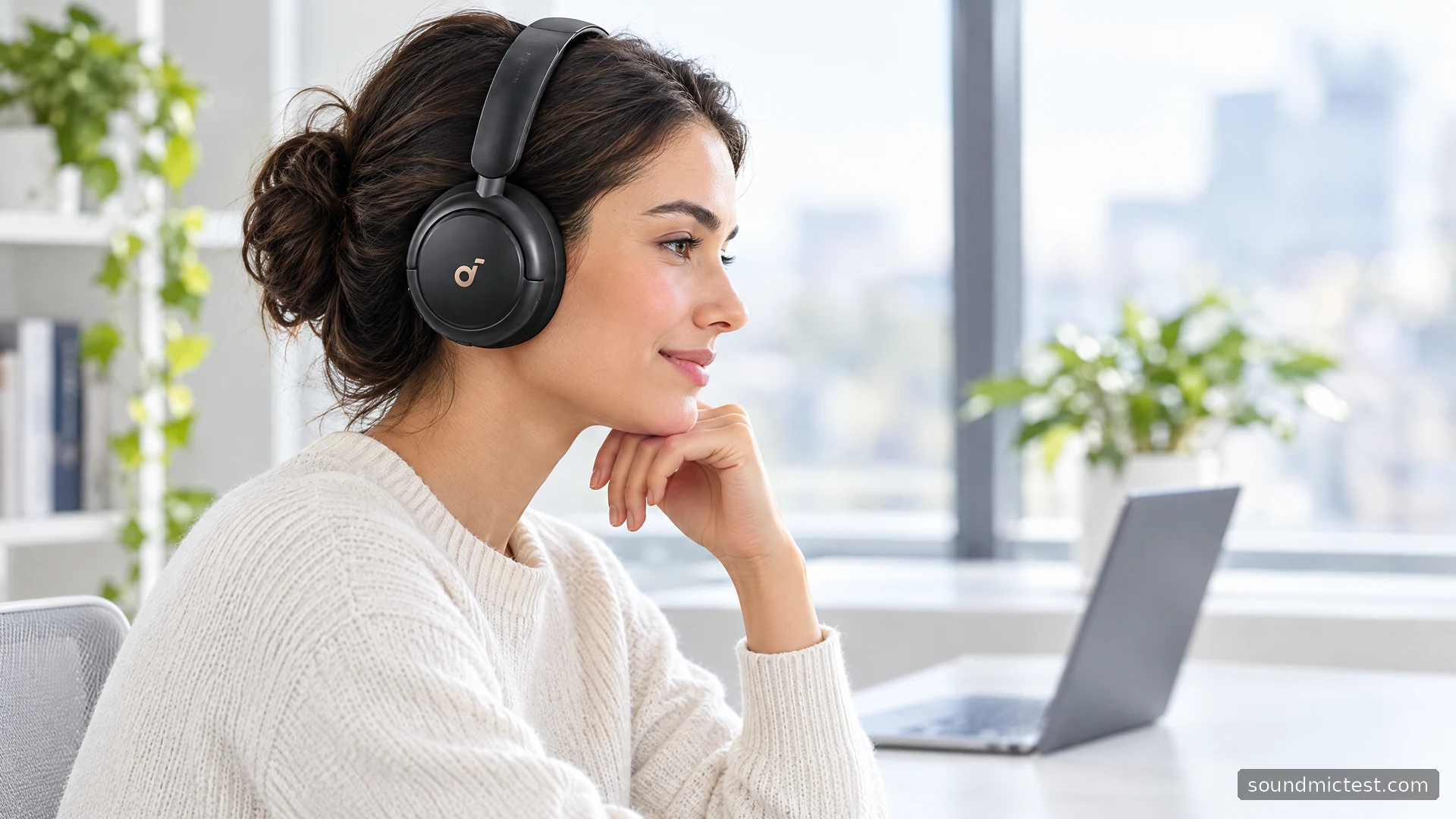 Black Soundcore Life Q30 worn at a bright white desk