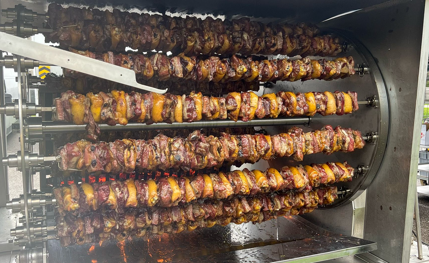 Meat cooking on a traditional spiedo