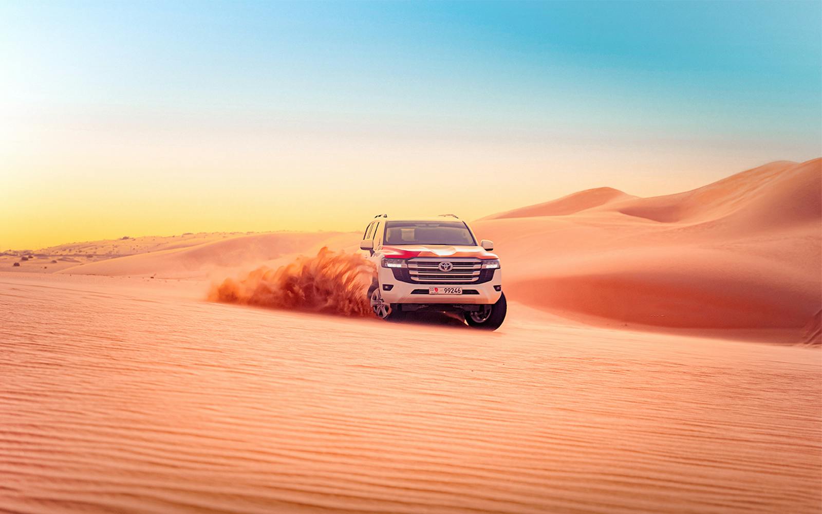 Abu Dhabi Evening Desert Safari with 4x4 Dune Bashing, Camel Ride, & BBQ Dinner Image 1
