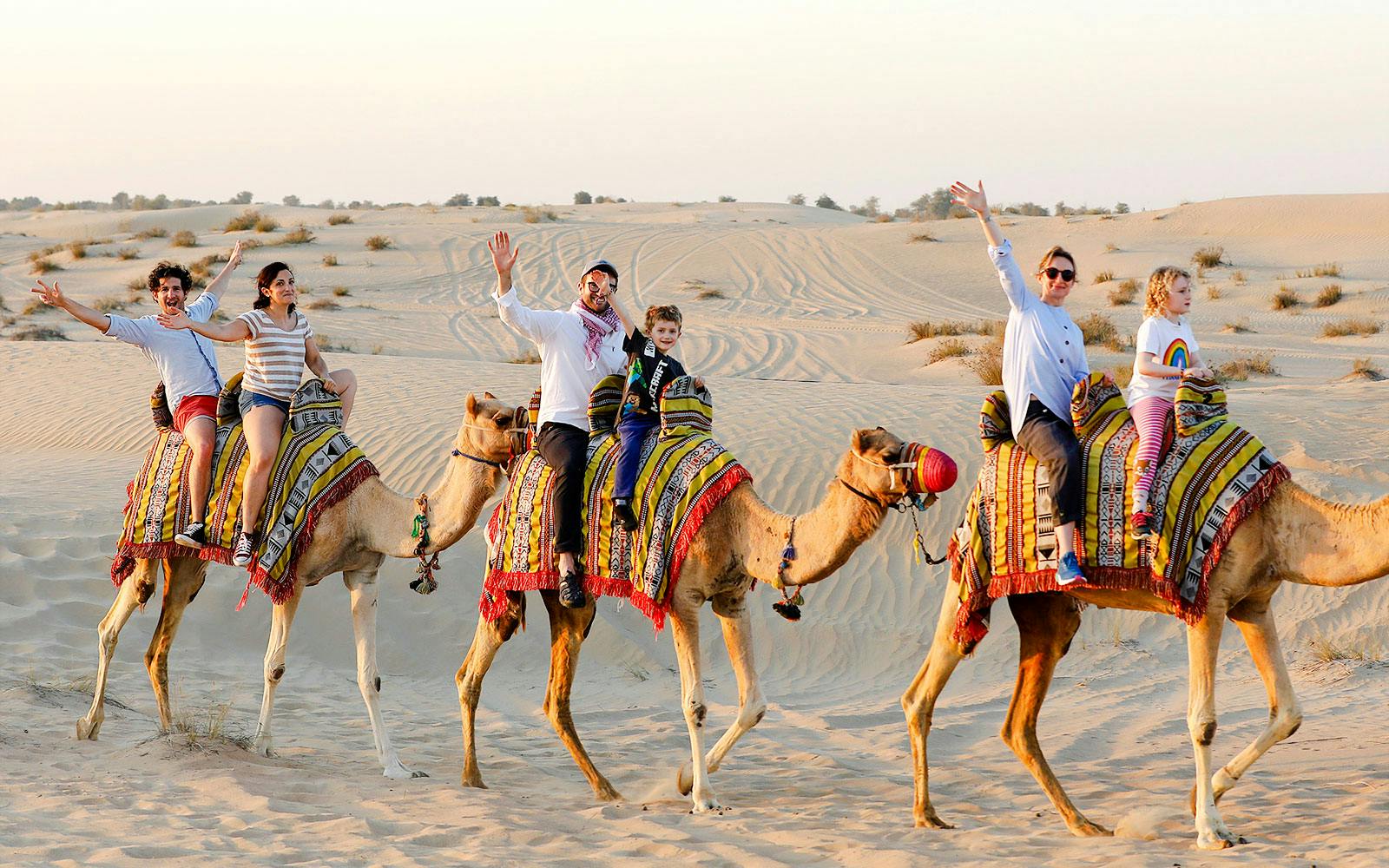 Abu Dhabi Premium Desert Safari with BBQ Dinner, Camel Ride and Sandboarding Image 2