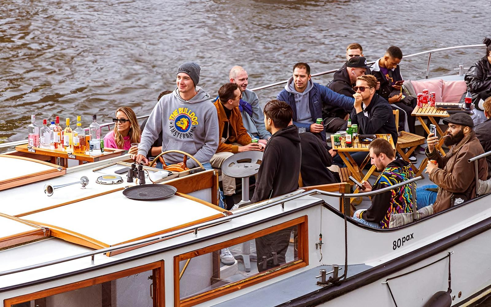 Amsterdam: 1-Hour Smoke-Friendly Cruise with 2 Drinks on Semi-Open Boat Image 1