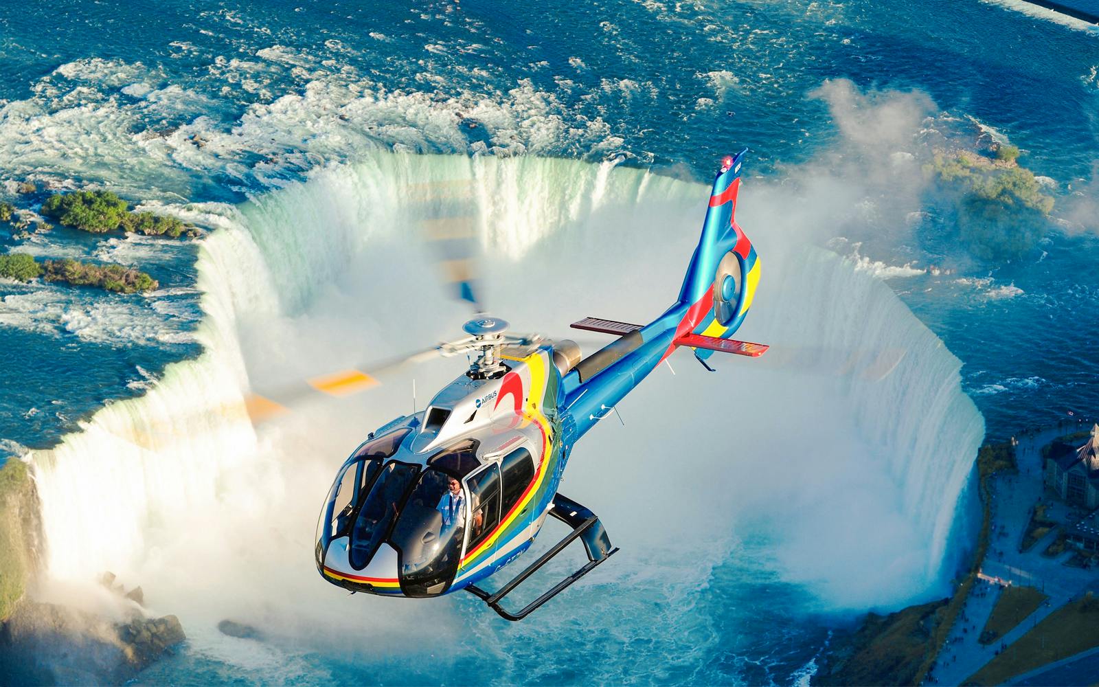 Niagara Falls Canada: Ultimate Helicopter Tour with Hornblower Cruise & Journey Behind the Falls Image 1