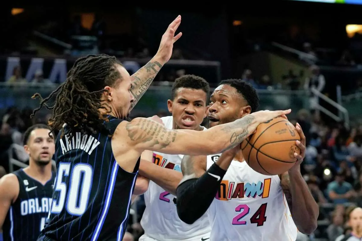Heat use balanced scoring, rally to beat Magic 107-103 in OT