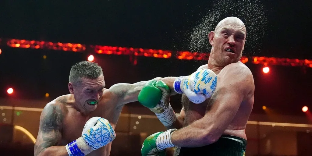 Usyk asks Fury to sign photo of him being punched in face