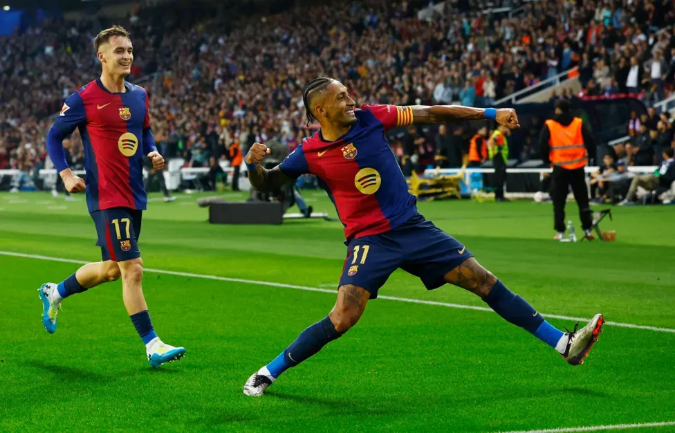 Barcelona beat rivals Espanyol to go nine points clear at top