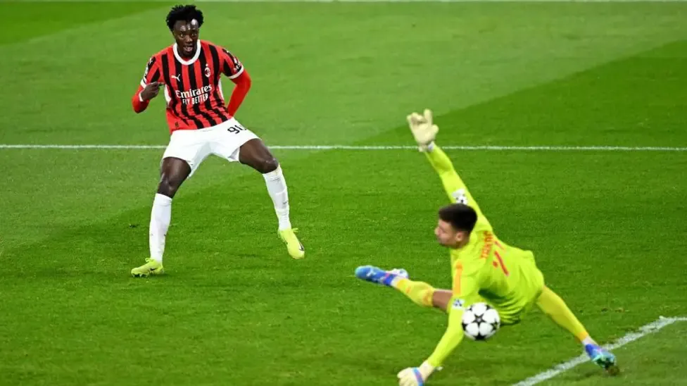Abraham helps AC Milan edge past Slovan Bratislava