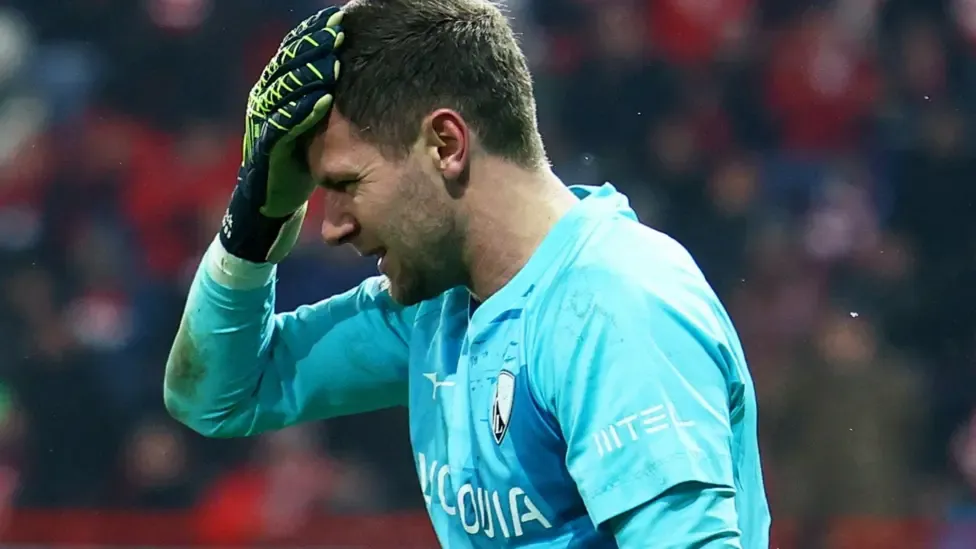 Bundesliga match suspended after keeper hit by object