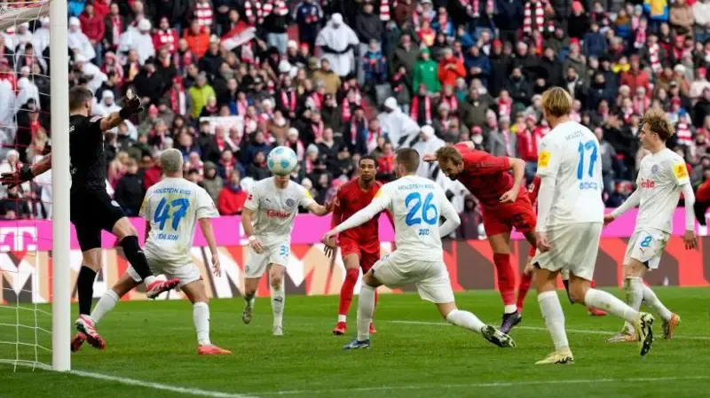 Kane hits double as Bayern survive Kiel comeback