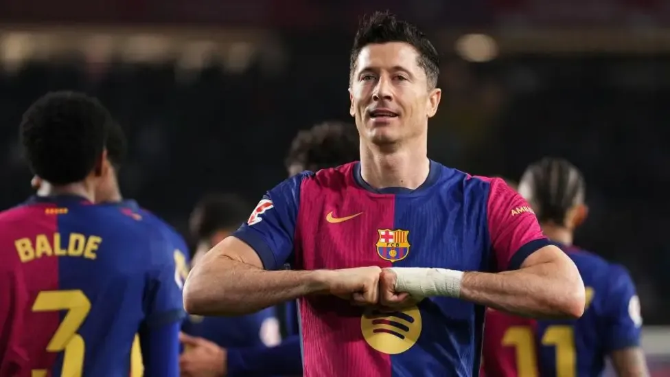 Barca edge out Rayo Vallecano to go top of La Liga