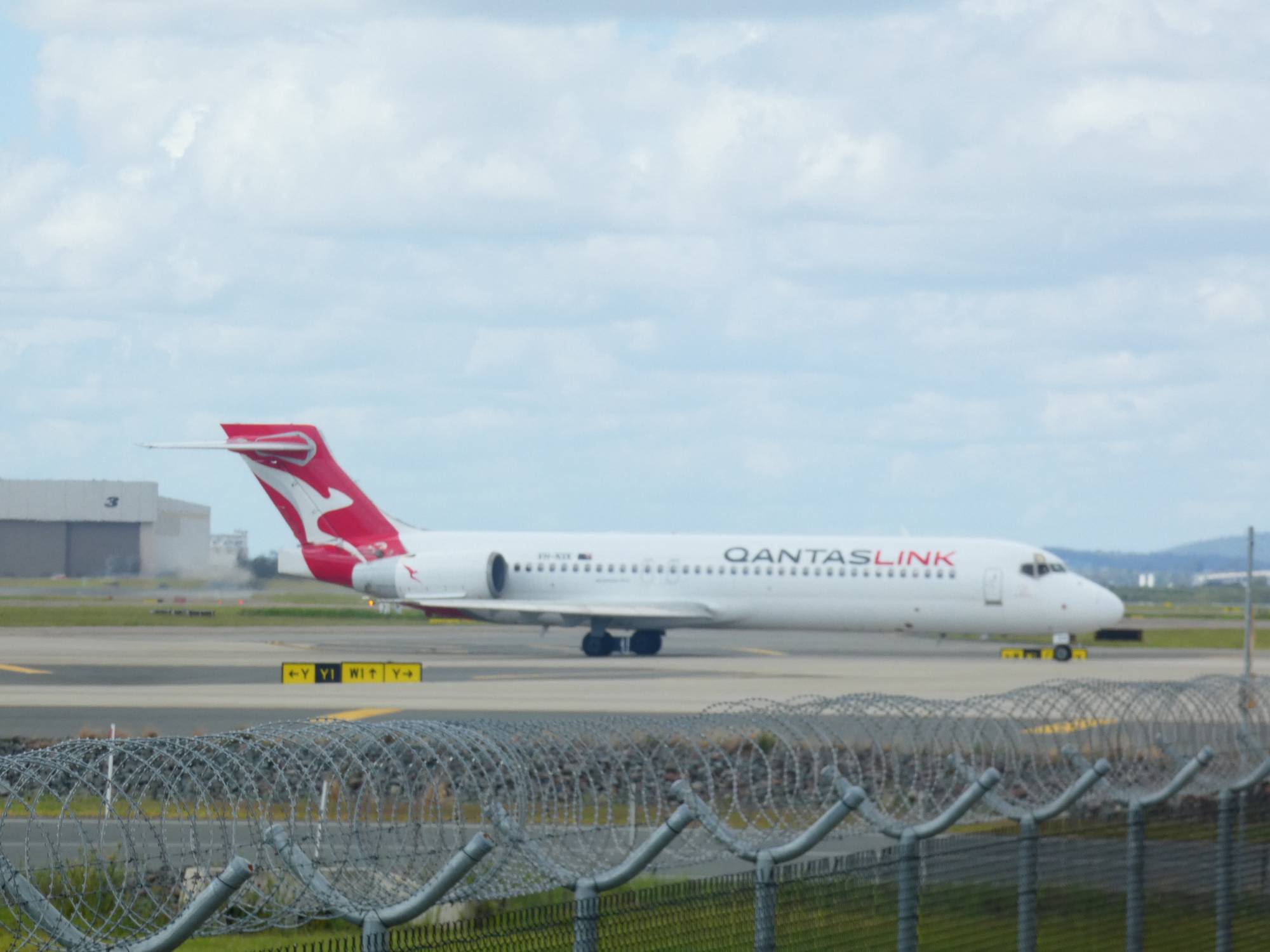 QantasLink (National Jet Systems) VH-NXK at YBBN by SingingAvgeek
