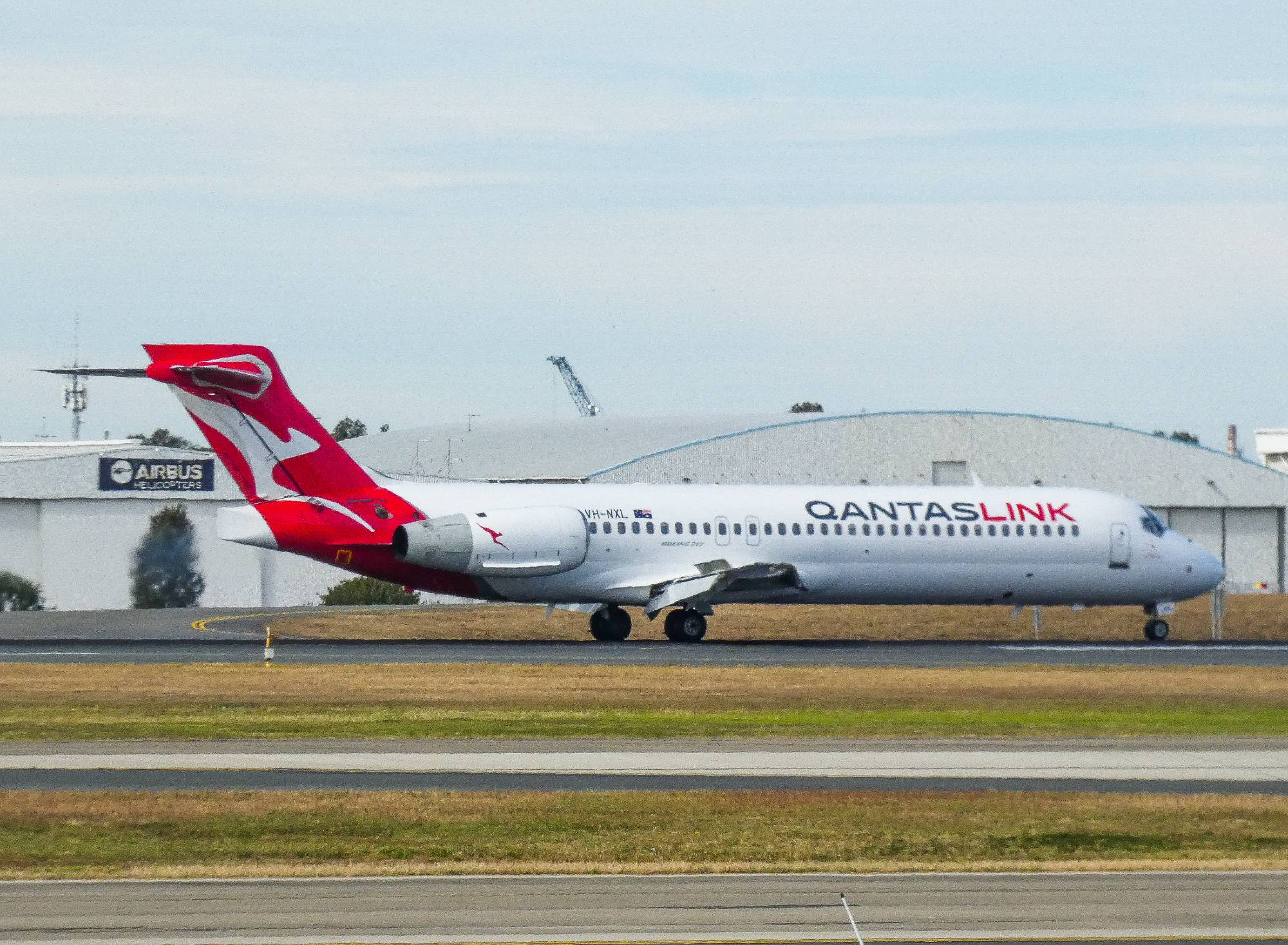 QantasLink (National Jet Systems) VH-NXL at YBBN by SingingAvgeek