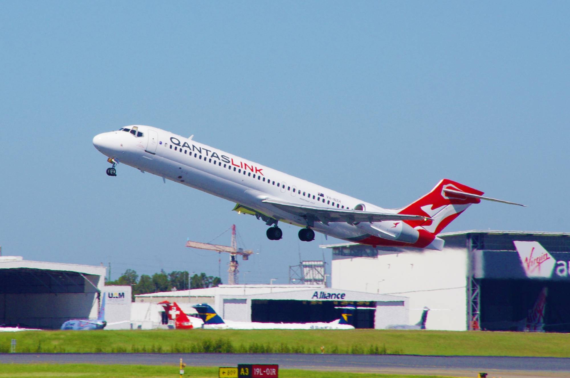QantasLink (National Jet Systems) VH-NXH at YBBN by SingingAvgeek