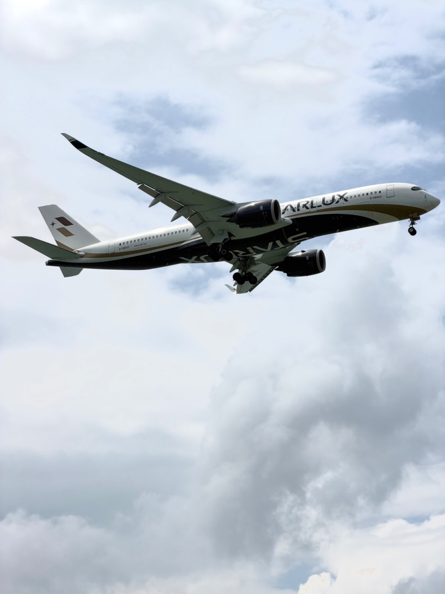 Starlux B-58503 at WSSS by Melovesplanes