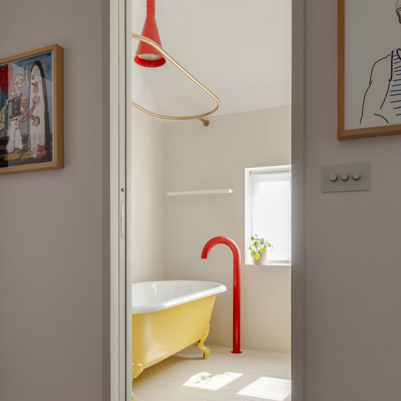 Bathroom with red tap