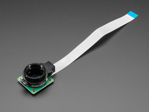 Angled shot of Raspberry Pi HQ camera module connected to FPC ribbon cable.