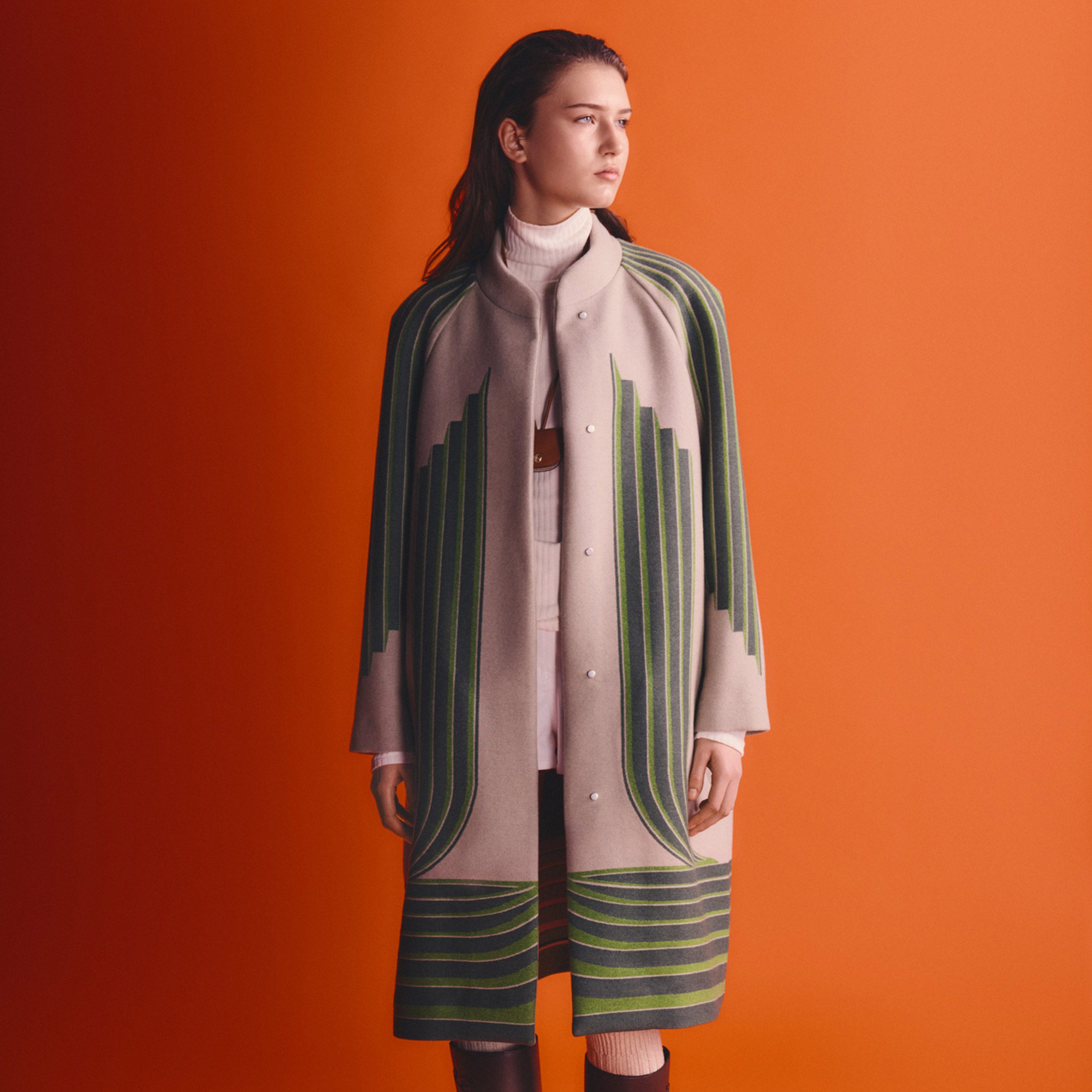 Woman in green and white coat