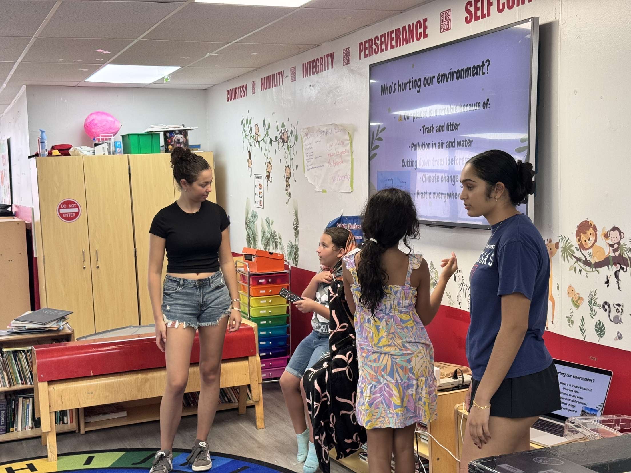Female students leading STEM presentations at Zhang Sah Women in STEM event