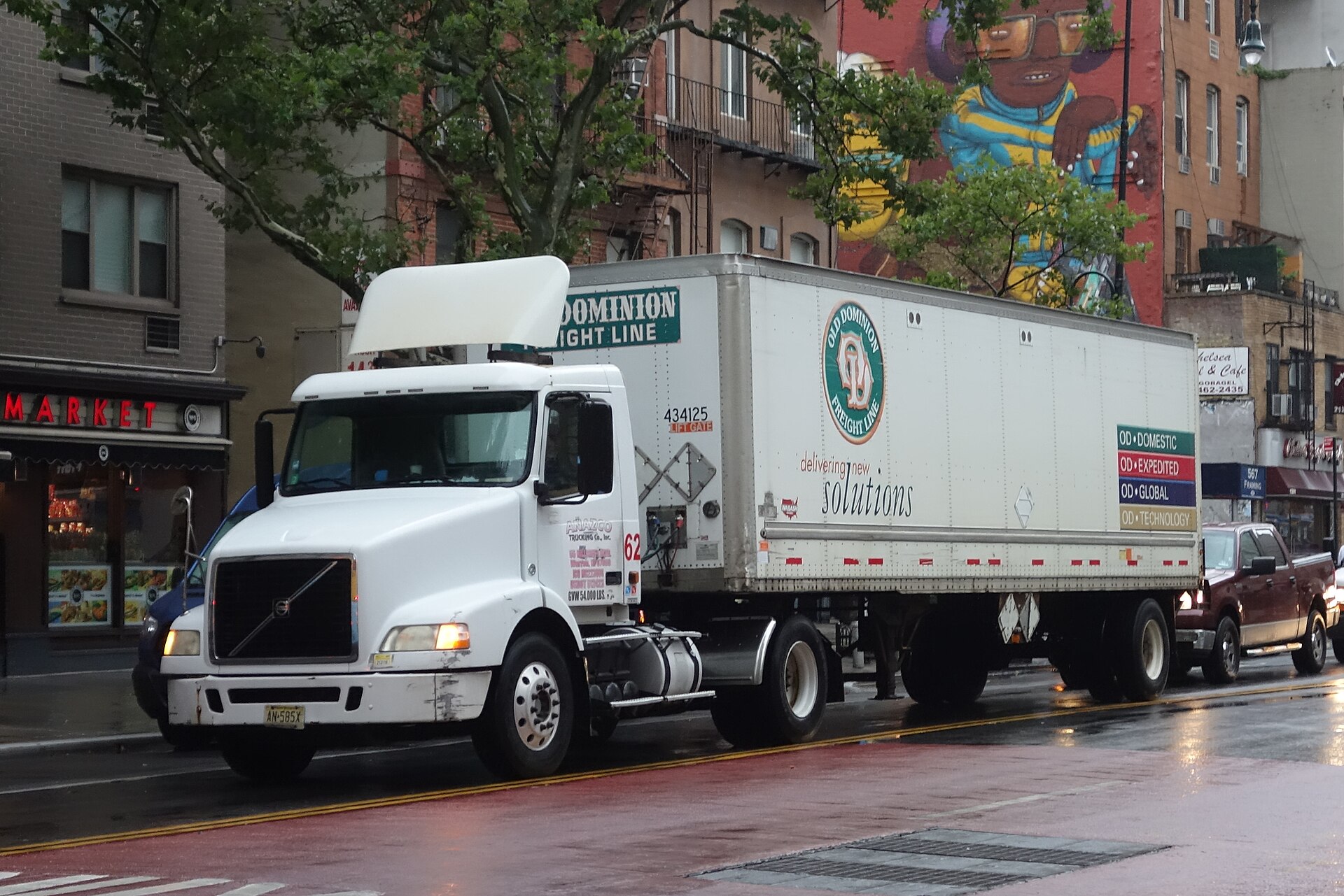 A tractor pulling an Old Dominion freight trailer on a Manhattan street.