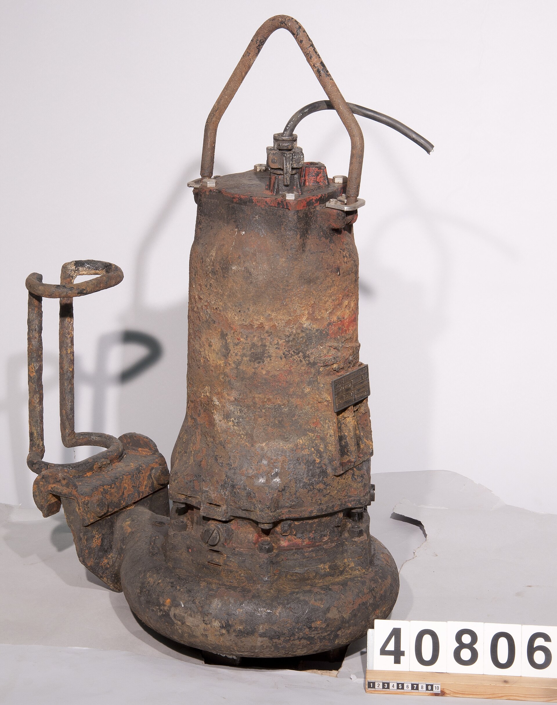 Historical Flygt CP 3100 wastewater pump with visible age and rust.
