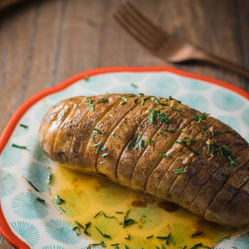 Slow Cooker Hasselback Potatoes with Honey-Sriracha Butter
