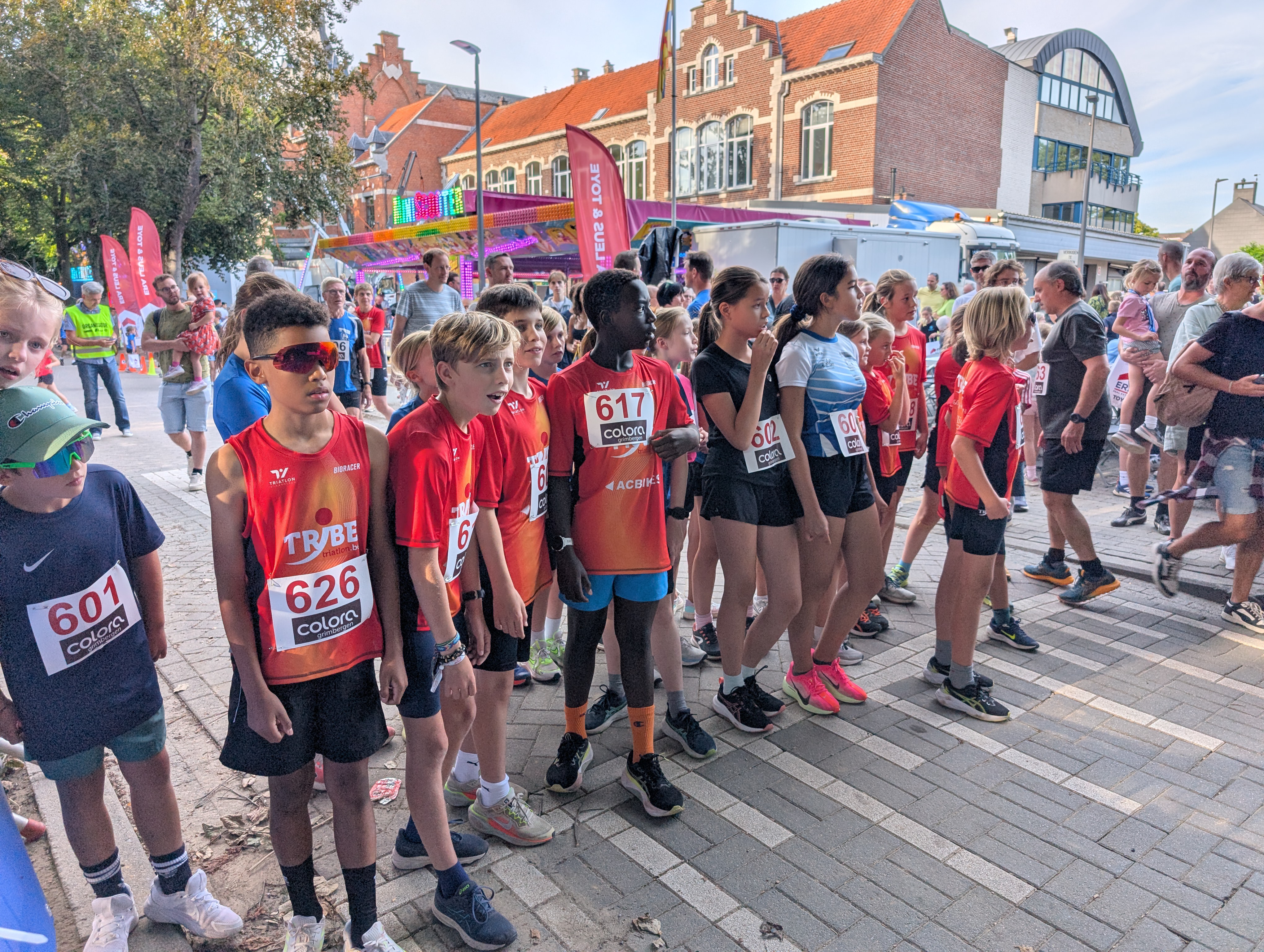 Group of youth athletes running together.