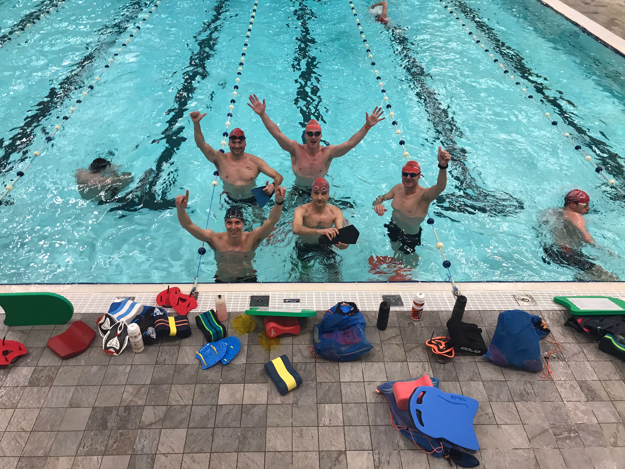 Group of athletes swimming together.