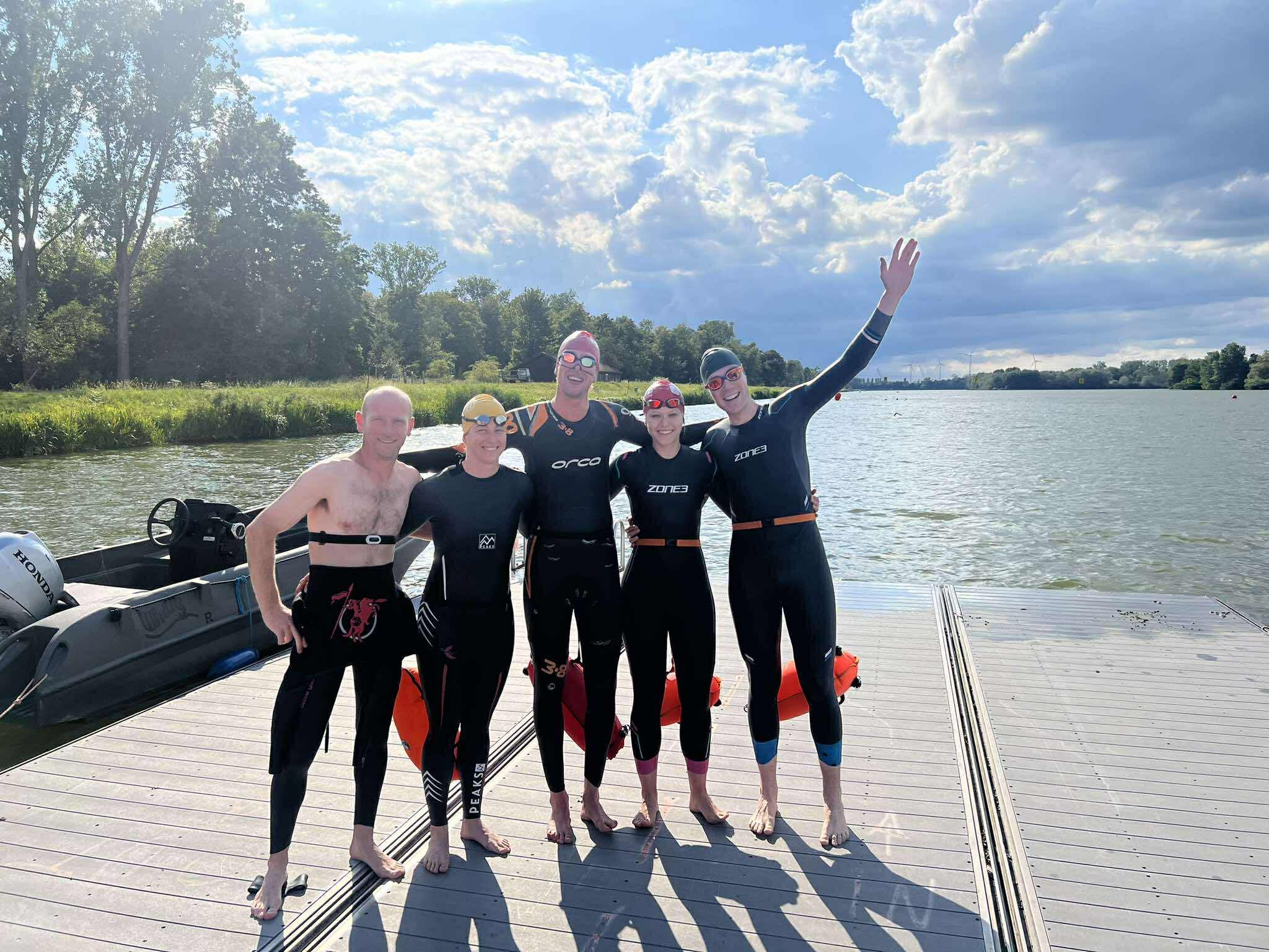 Group of athletes swimming together.