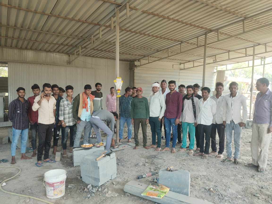 Artisan carefully carving a detailed pattern into a marble slab.