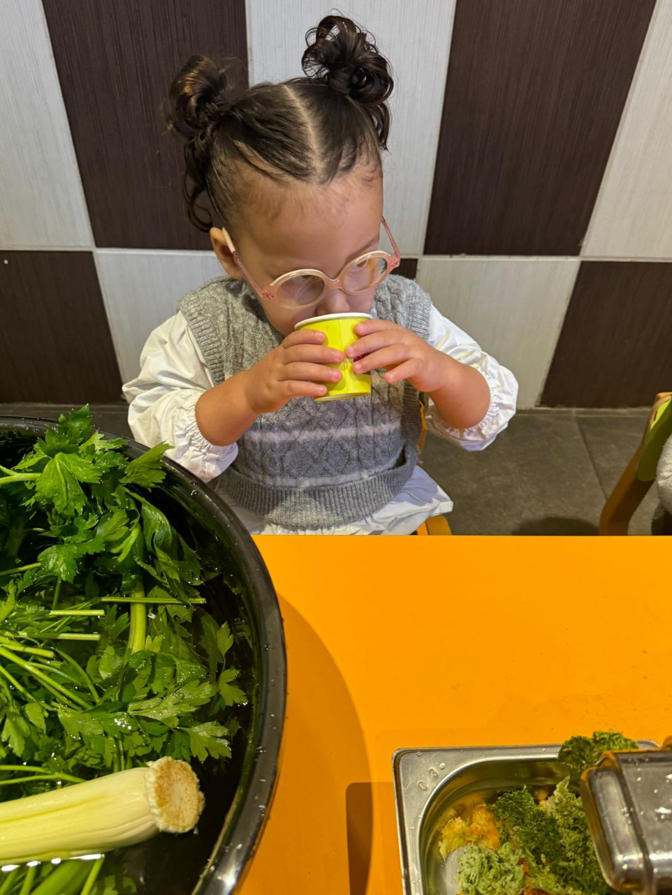 Children drawing at a table.