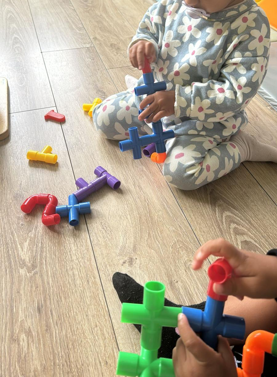 A child playing with a toy car.
