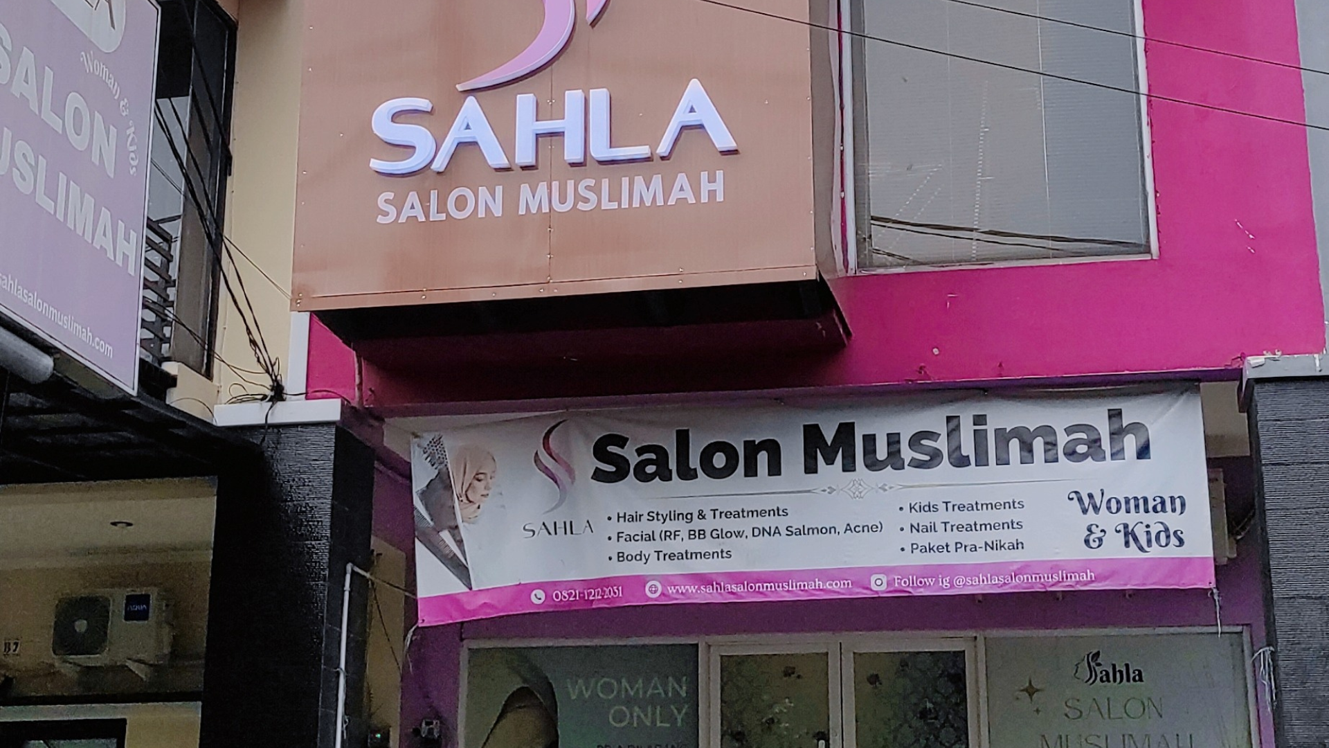 A group of friendly salon staff members smiling.