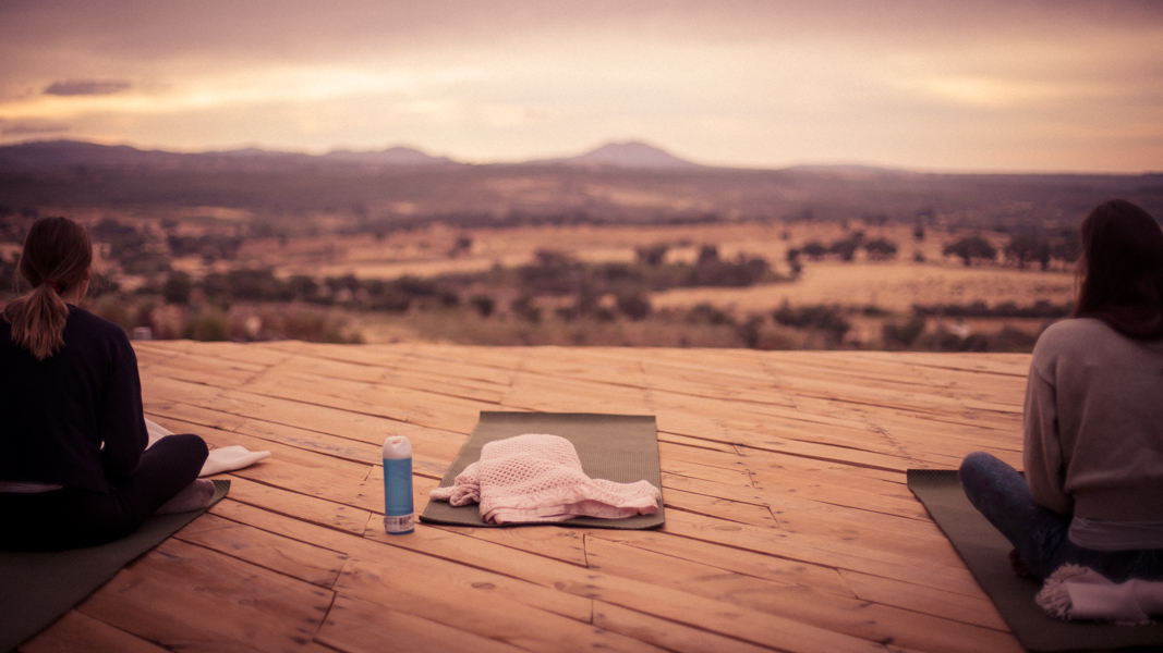A serene yoga pose on the beach.