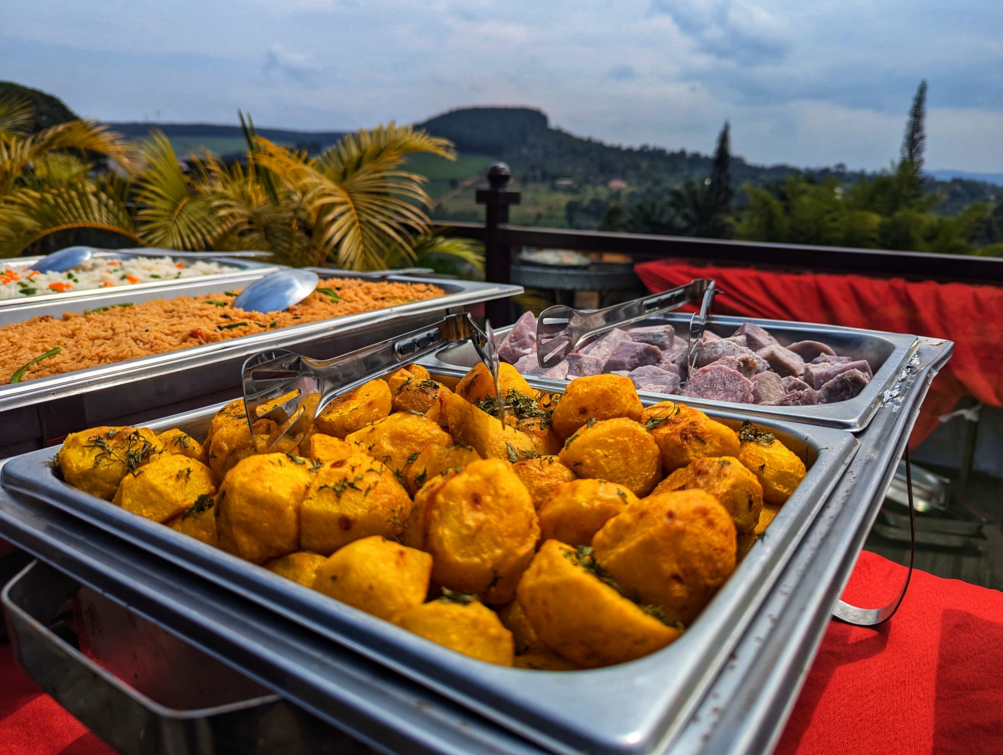 An elegant restaurant setup with a view of the resort's gardens.