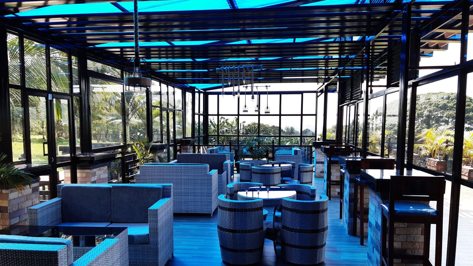 A large group of people enjoying a meal together at a long table.