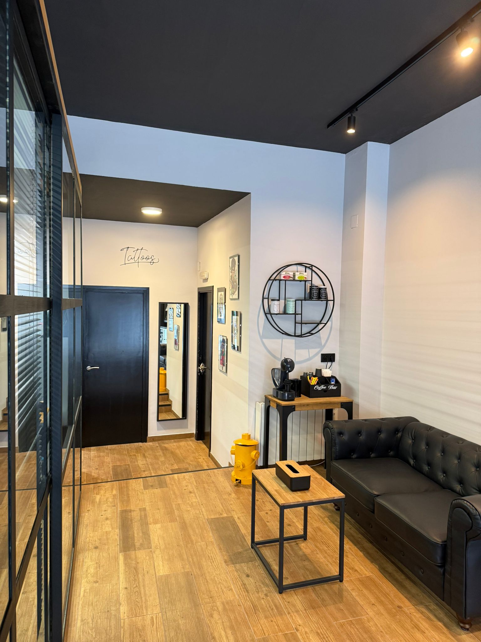 Close-up of the front desk area with the studio's logo.