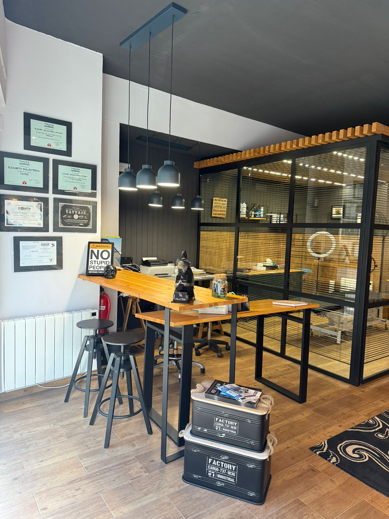 Interior of the tattoo studio, showing the front desk and waiting area.