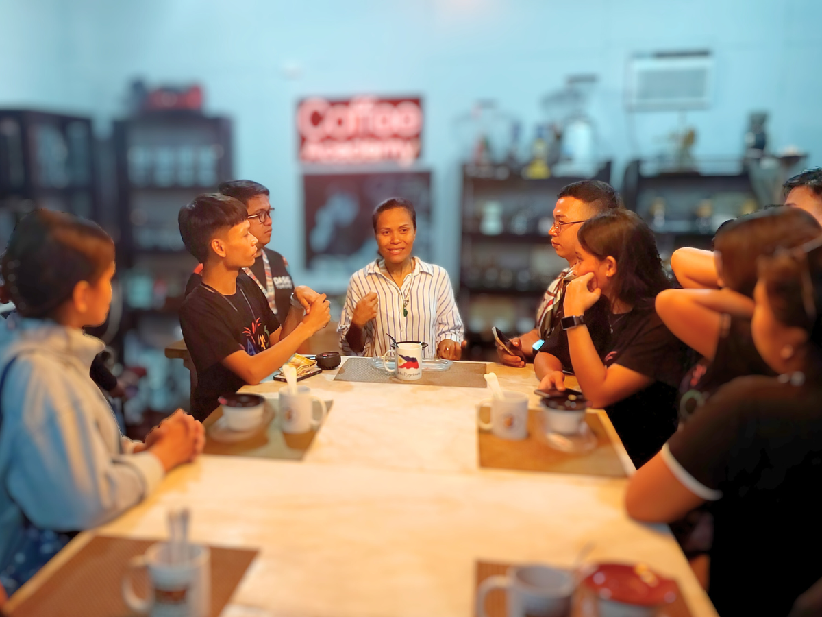 A barista creating latte art.