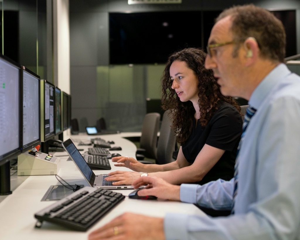 People collaborating around a laptop