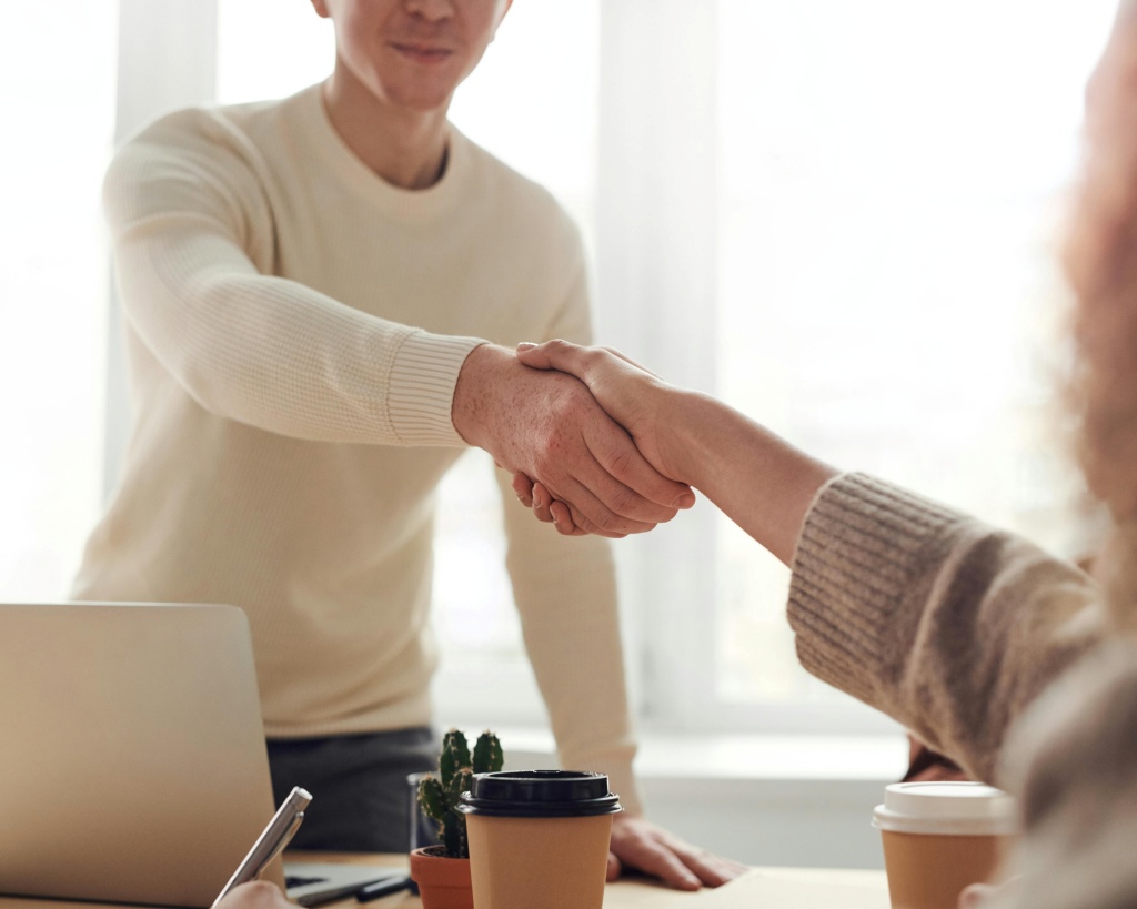 A person smiling while making a secure online payment
