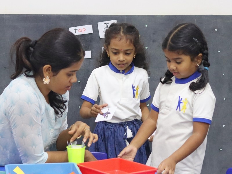 Teacher helping a young student