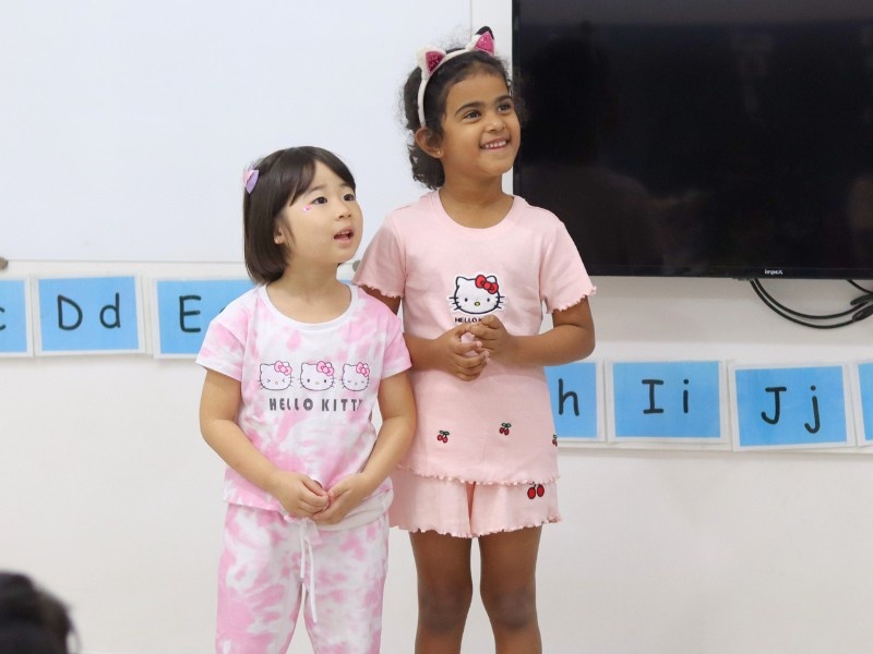 Child smiling in a classroom