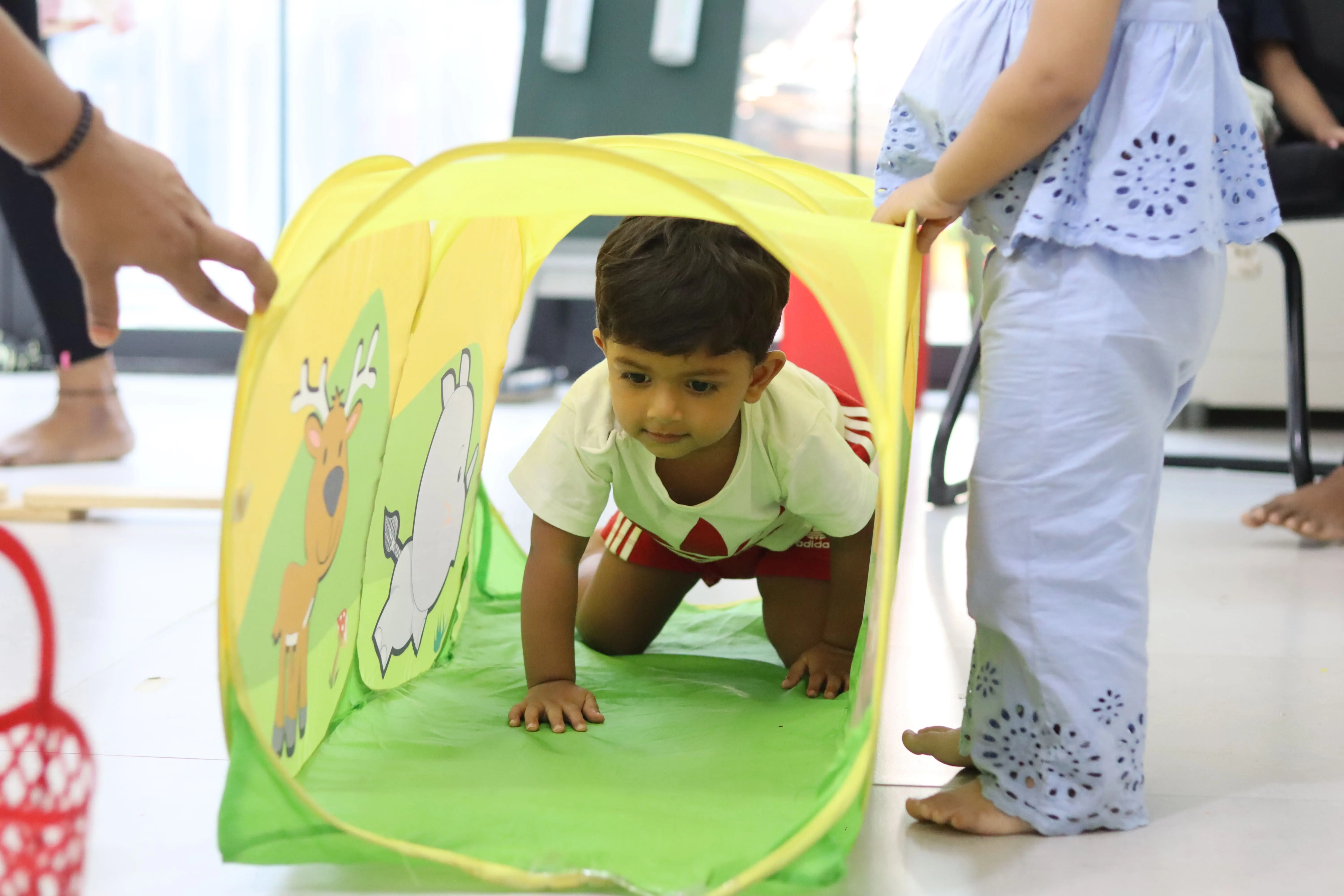child playing with colors