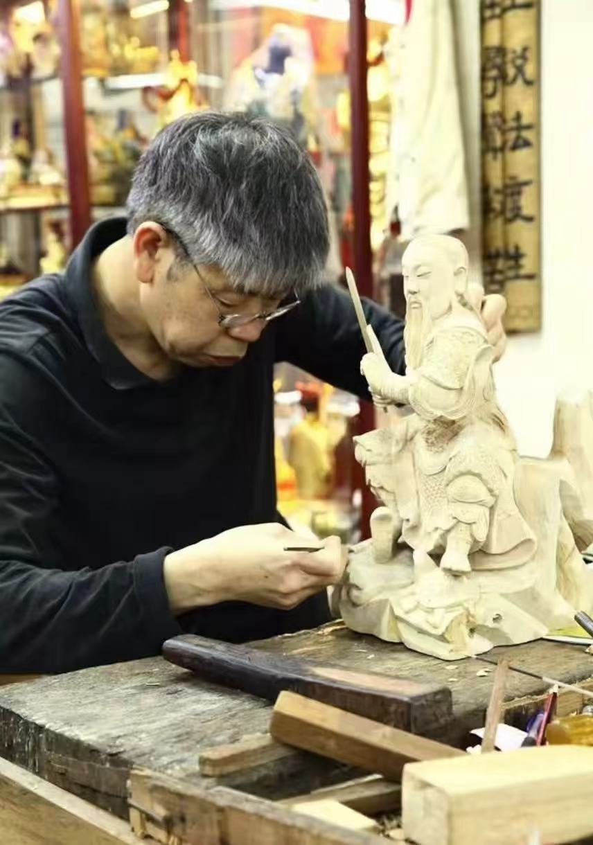 An artisan working on a custom wood carving.
