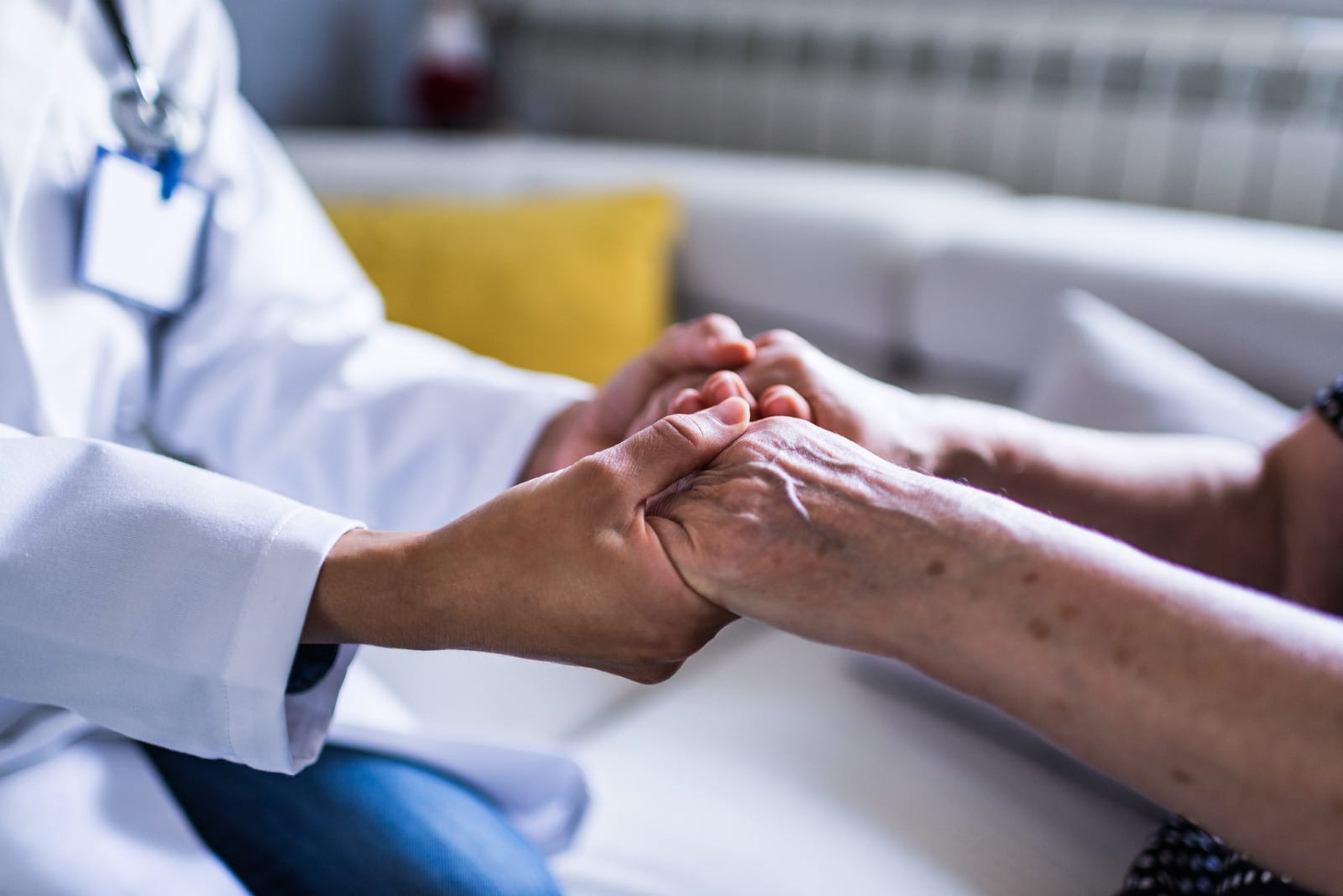 A doctor visits a patient at home, providing care at their doorstep.