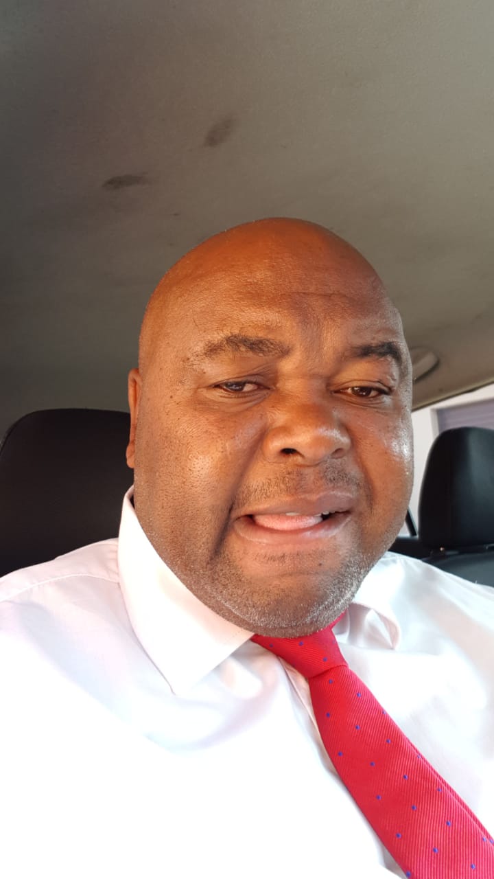 Portrait of Henry Qoli Mtebula, founder of QH Driving School.