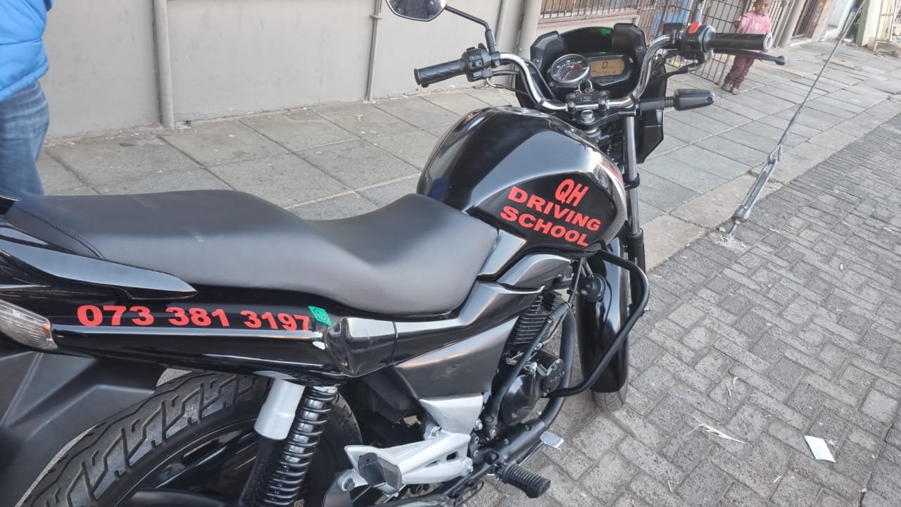 A person riding a motorcycle on an open road.