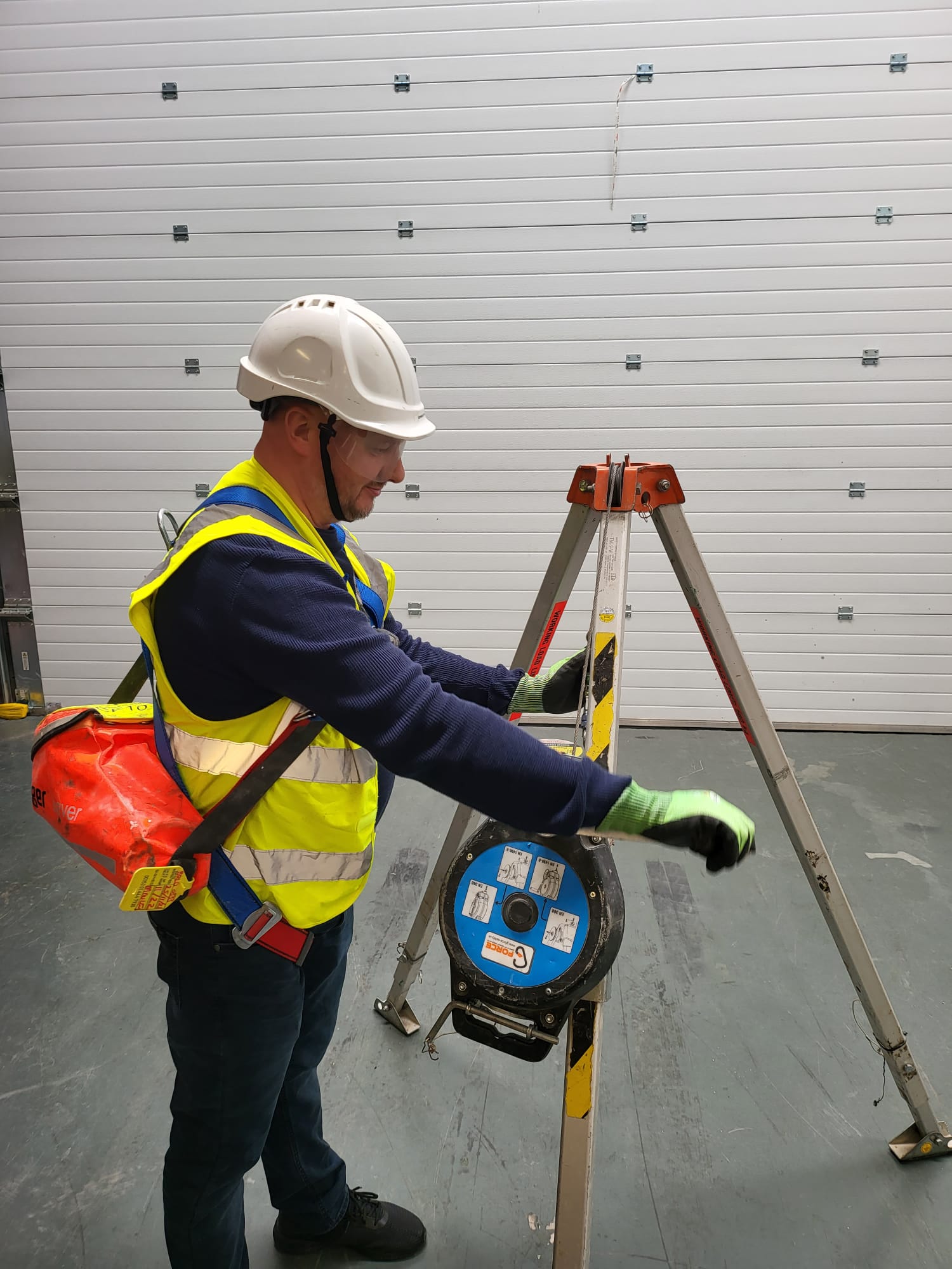 Trainee practicing with safety equipment