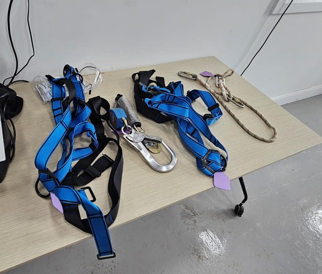 Instructor demonstrating safety harness