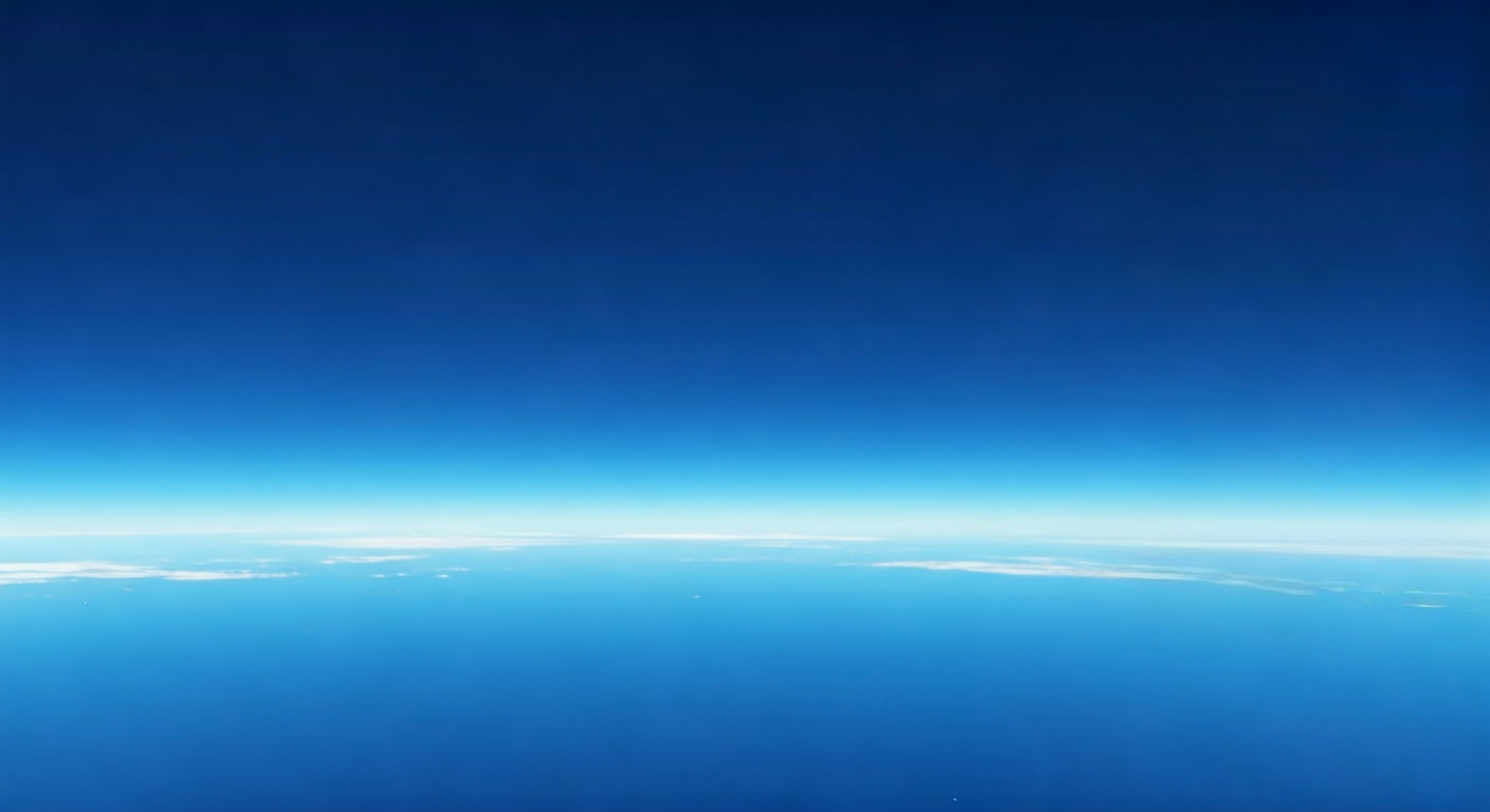 Vibrant blue sky illustrating atmospheric light scattering, with clear horizon line and gradual color intensity changes.