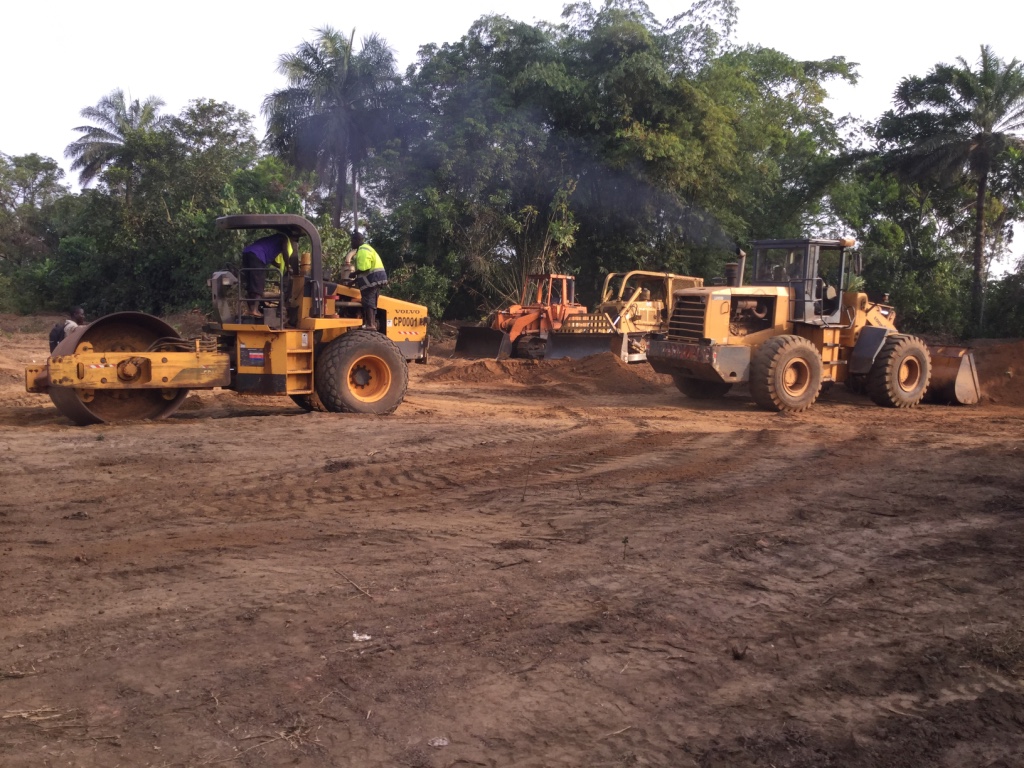 A fleet of heavy construction equipment, including dozers and graders.